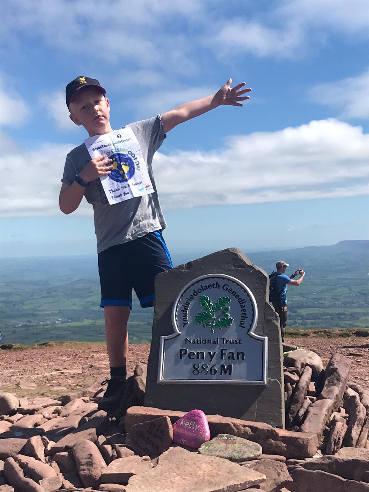 Child on top of Pen y Fan